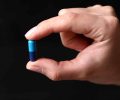 freepik_blue-medical-pill-hand