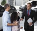 happy-couple-car-showroom-dealership